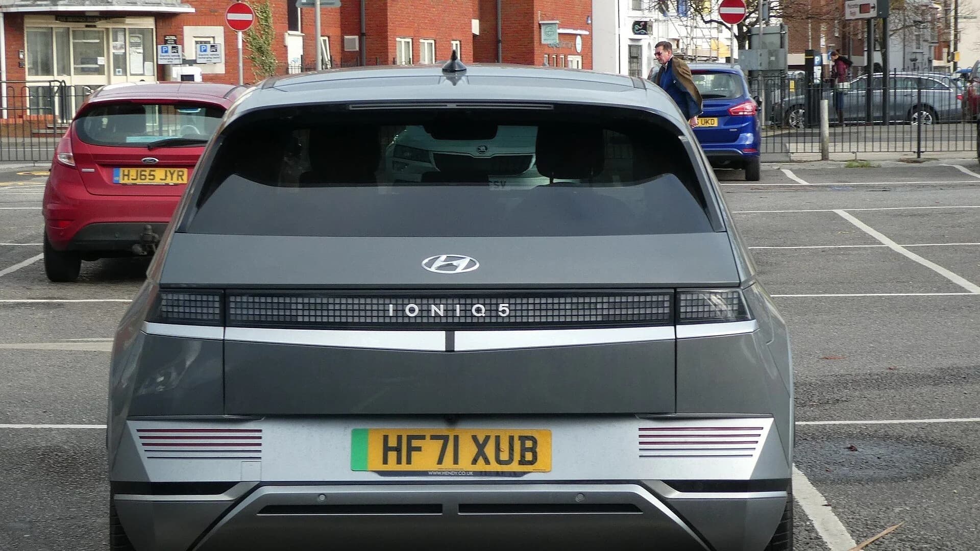 Rear view of a grey Hyundai IONIQ 5 EV parked in an outdoor car park.