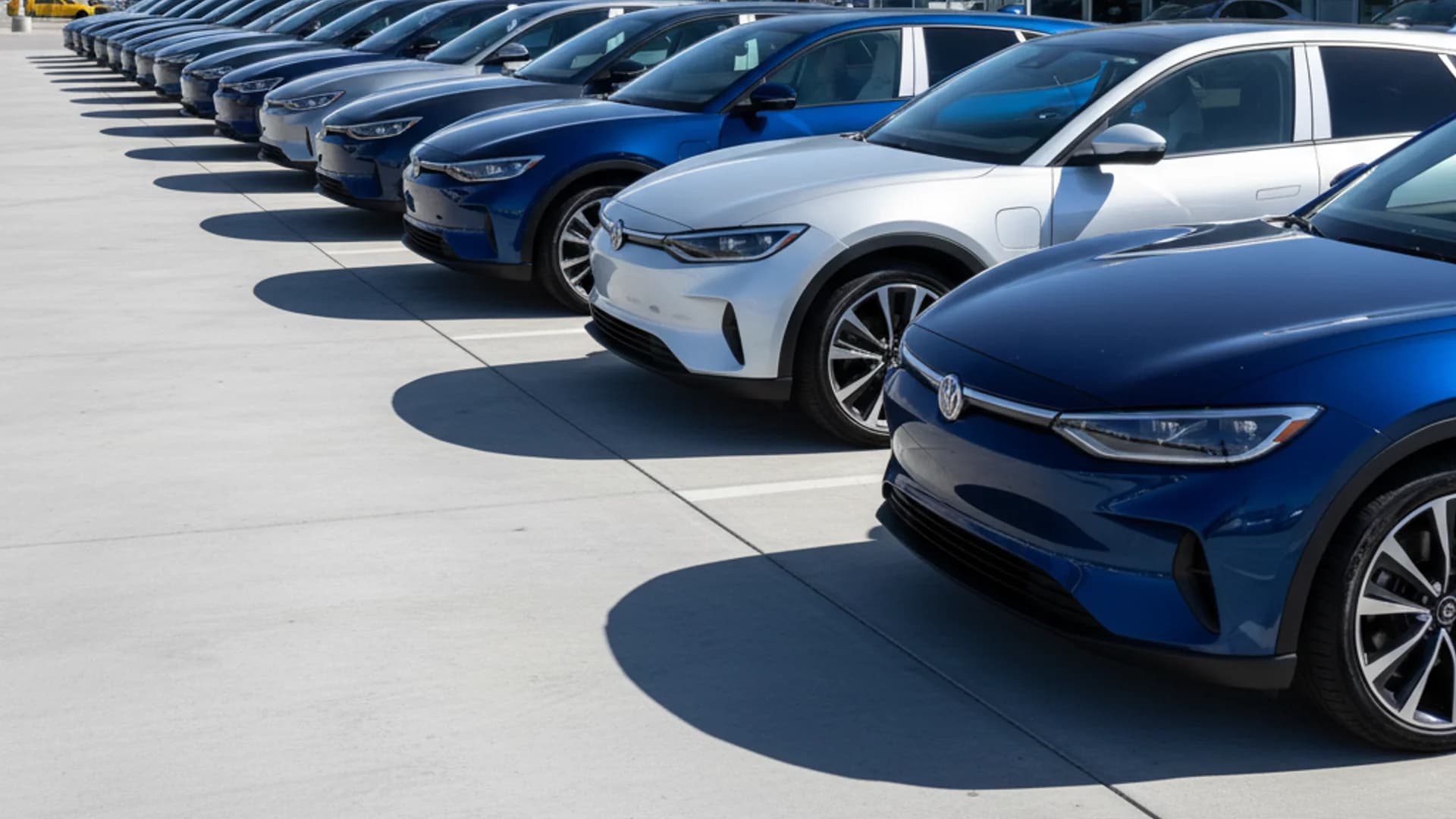 Canadian car dealership lot with electric vehicles and EVAP rebate signage