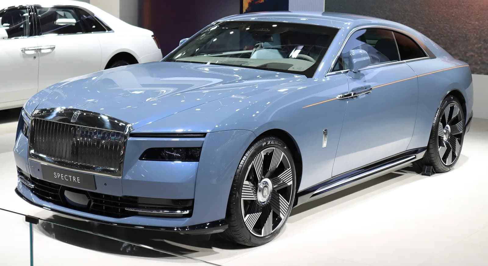 Light blue Rolls-Royce Spectre electric coupe on display, front three-quarter view