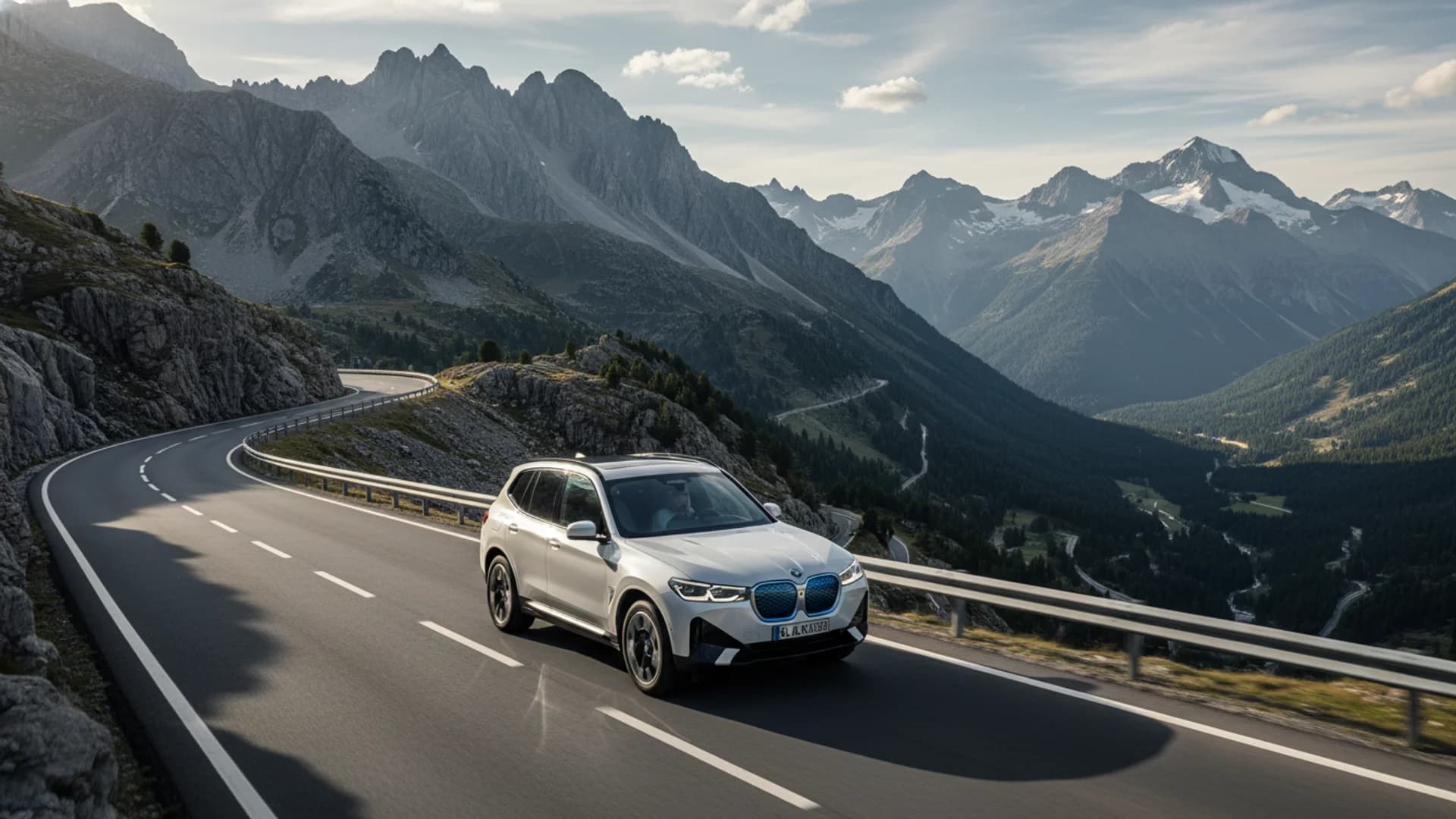 BMW iX3 electric SUV on a mountain highway