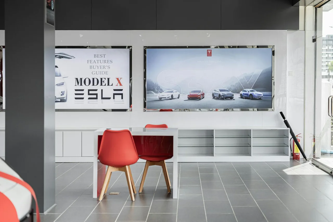 Modern electric vehicle showroom displaying affordable EVs that highlight the price gap between Chinese and North American models