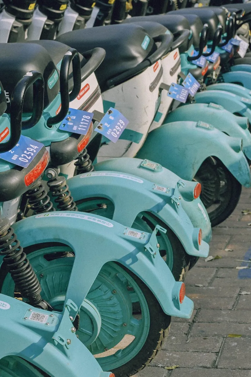 Close-up of a person plugging in an electric car at a charging station outdoors.