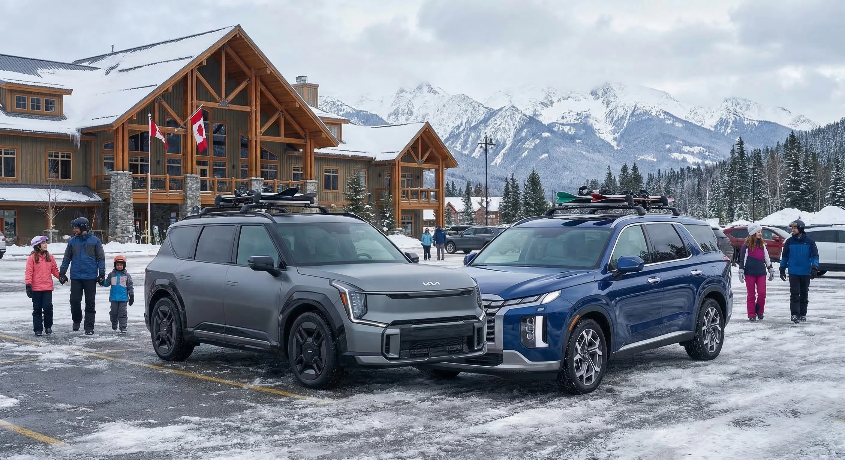 Kia EV9 and Hyundai Ioniq 9 three-row electric SUVs parked side by side at a Canadian ski resort with snow-covered mountains