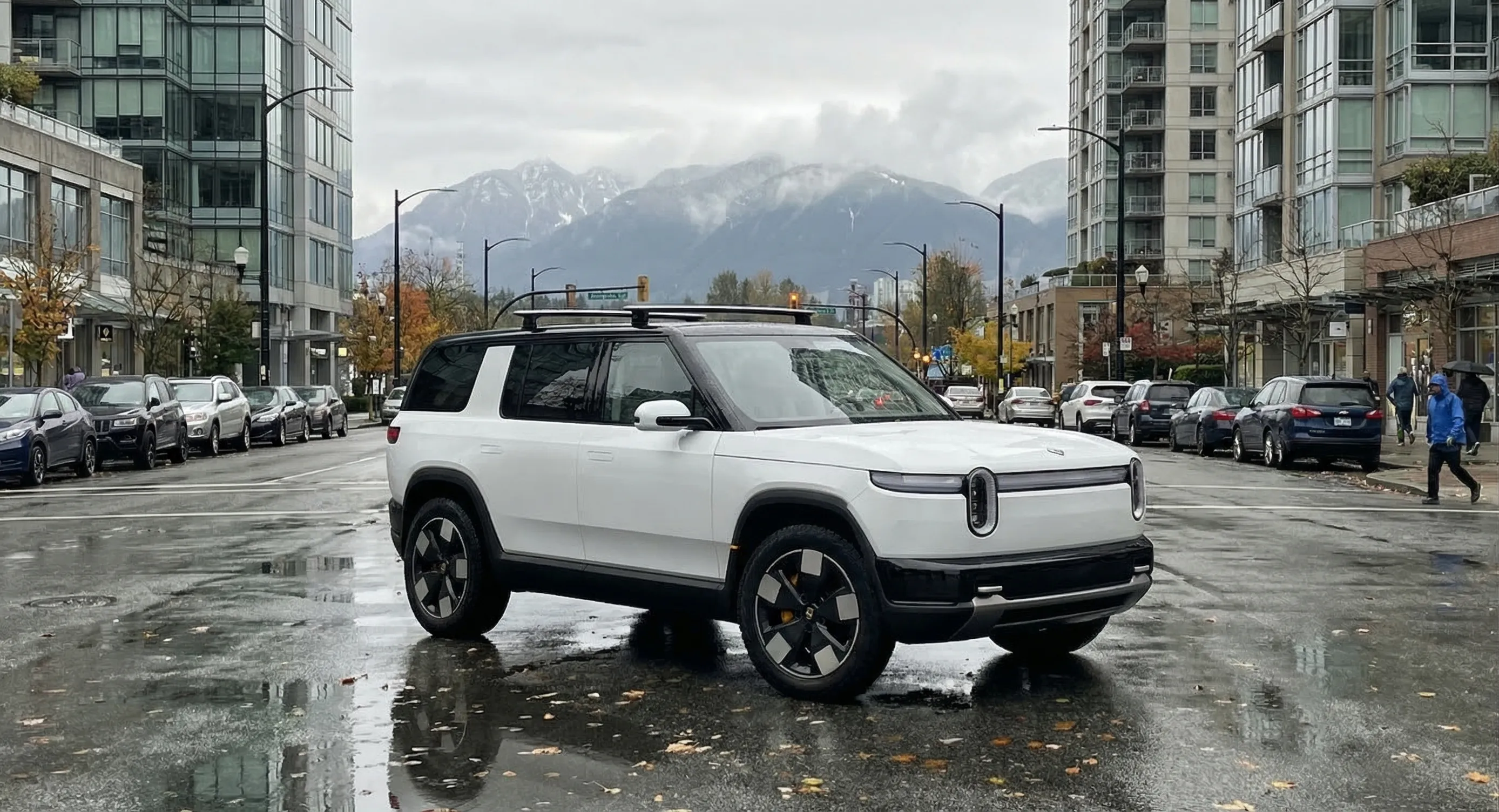 Rivian R2 compact electric SUV side profile in urban Canadian setting