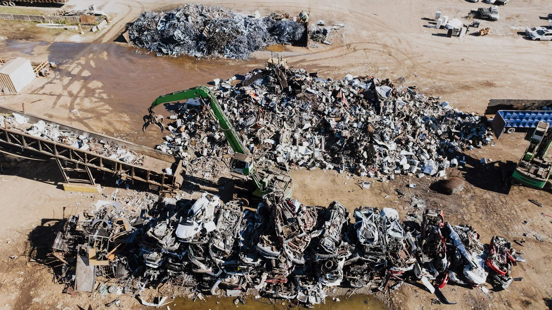 Red electric car parked outdoors, showcasing sleek design amidst winter scenery.
